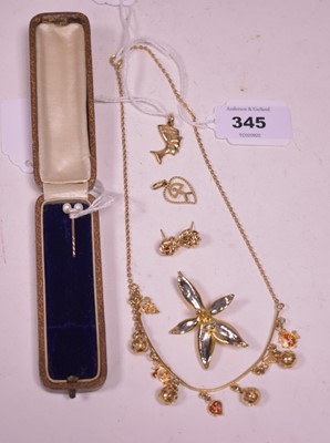 Lot 345 - Gold and yellow metal charms and jewellery