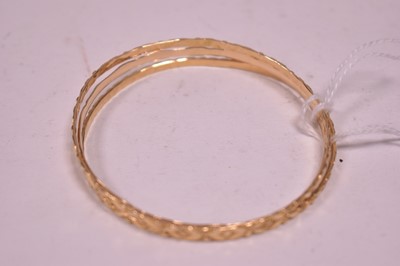 Lot 343 - Three Arabic gold bangles