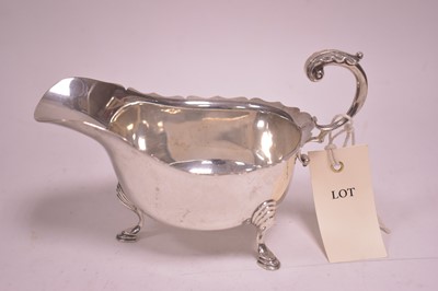 Lot 301 - A silver sauce boat
