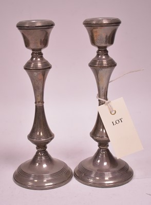 Lot 330 - A pair of silver candlesticks