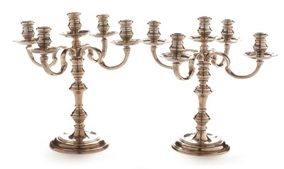 Lot 203 - A pair of silver candelabra