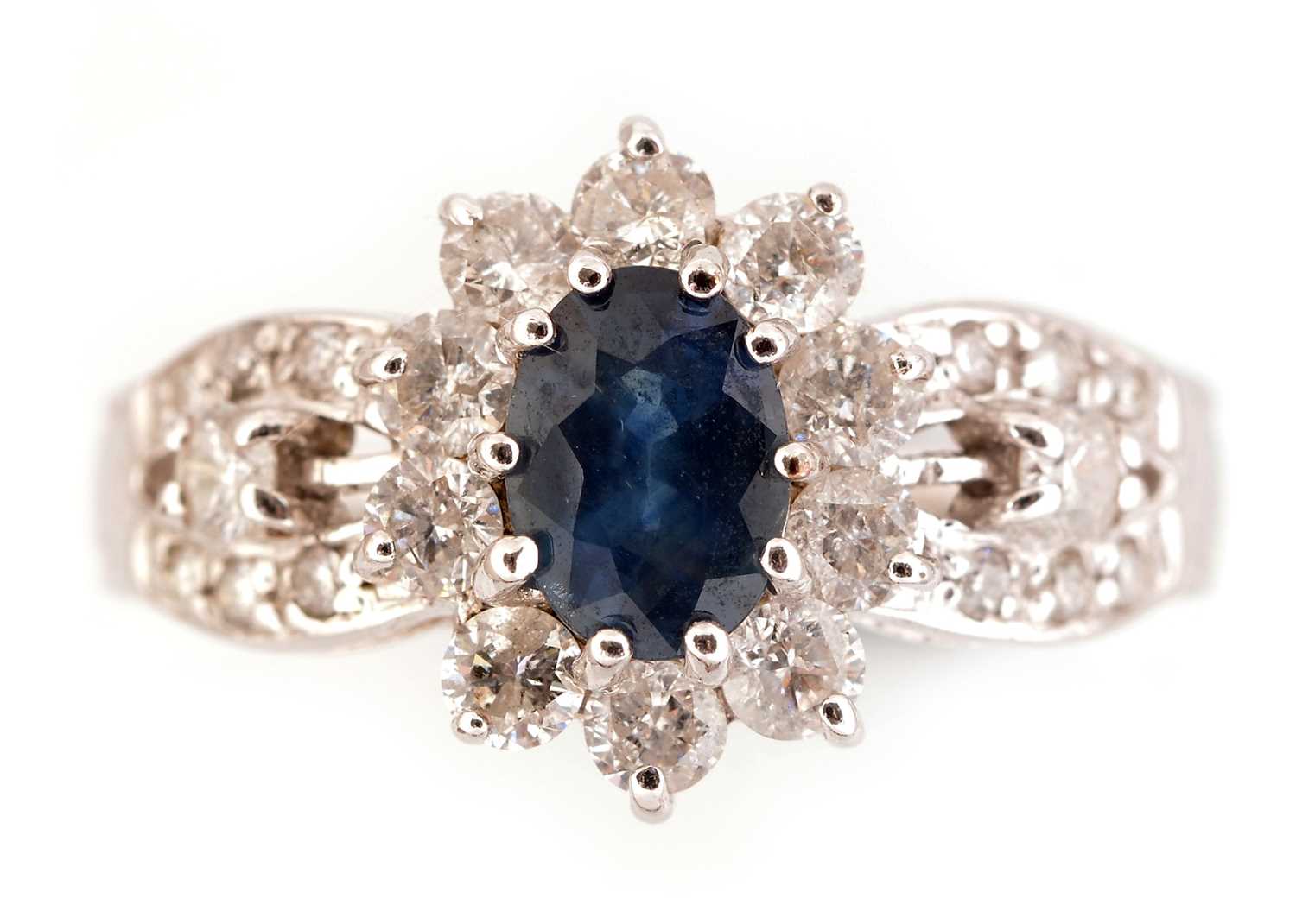 Lot 47 - Sapphire and diamond cluster ring