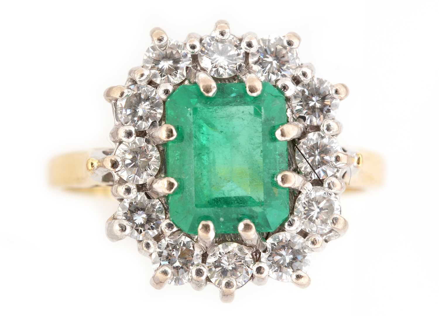 Lot 69 - Emerald and diamond cluster ring