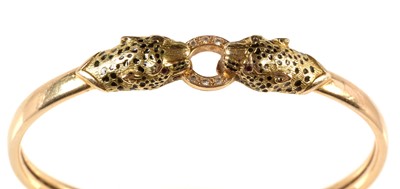 Lot 142 - A leopard pattern yellow metal bangle