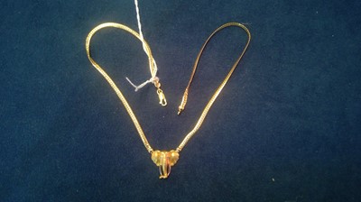 Lot 145 - A 9ct yellow gold elephant pattern necklace