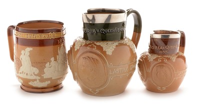 Lot 486 - Three Doulton Victoria commemorative jugs