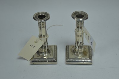 Lot 34 - A pair of silver candlesticks