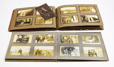 Lot 932 - An album of early/mid 20th Century postcards; and two photograph albums.