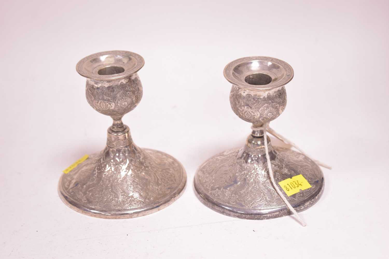 Lot 69 - Persian silver candlesticks