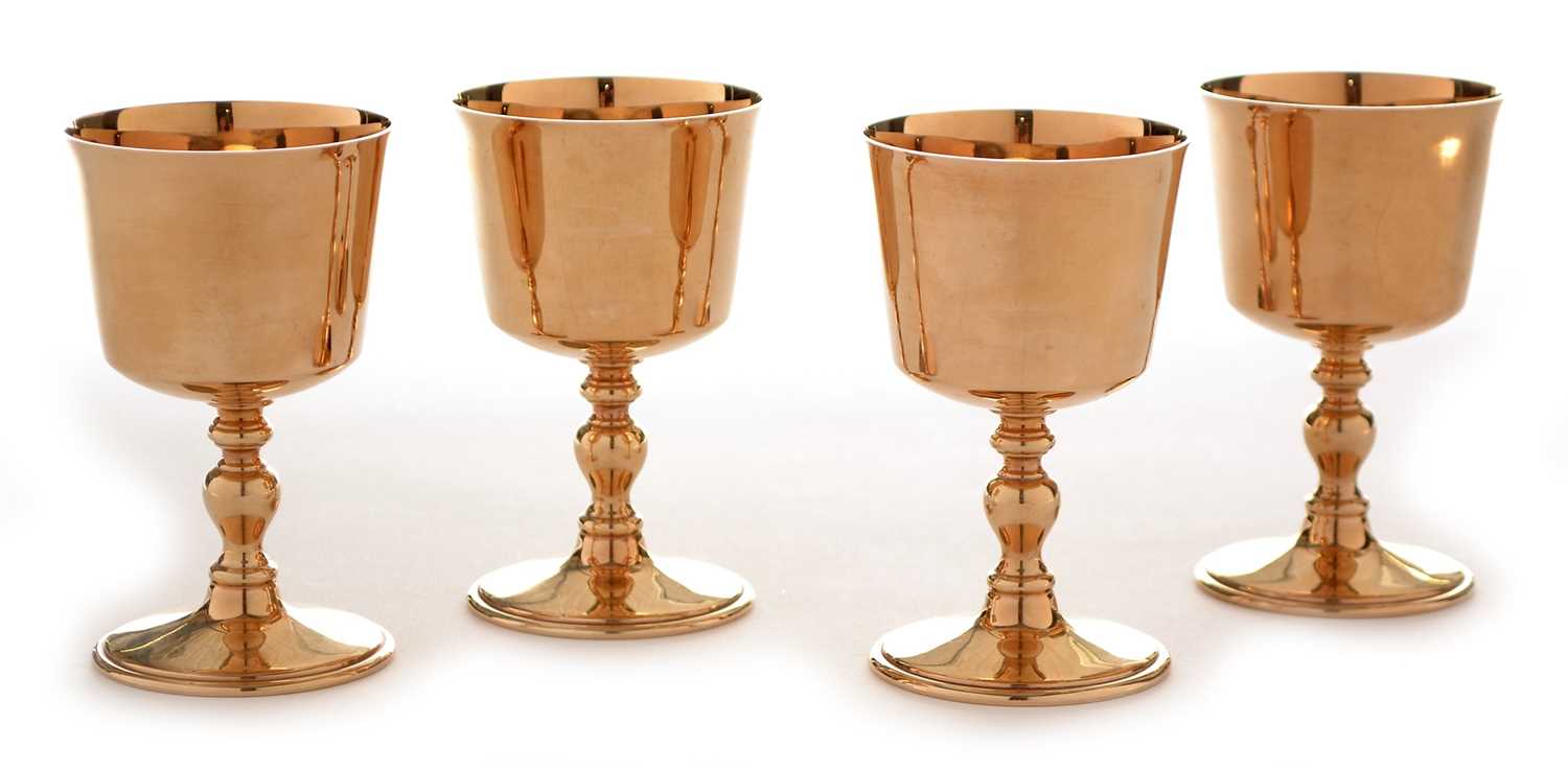 Lot 268 - A set of four 9ct yellow gold goblets