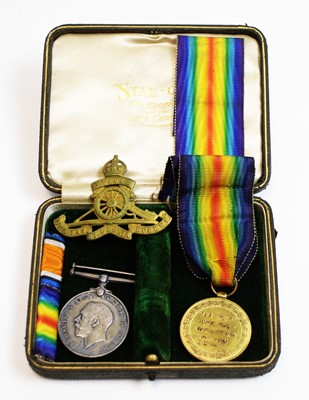 Lot 733 - British War Med, Victory Medal and Royal Artillery cap badge.