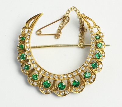 Lot 32 - Emerald and diamond crescent brooch