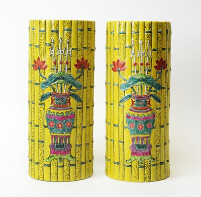 Lot 581 - Pair of Chinese yellow bamboo shaped vases.