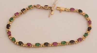 Lot 64 - A sapphire, emerald and ruby bracelet