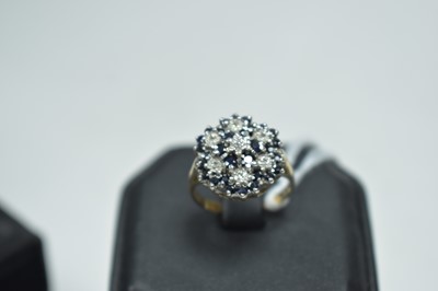 Lot 38 - Sapphire and diamond cluster dress ring