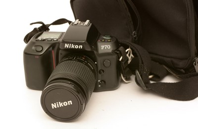 Lot 902 - Nikon F70 camera and lens.