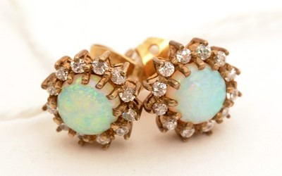 Lot 90 - A pair of opal and diamond cluster earrings