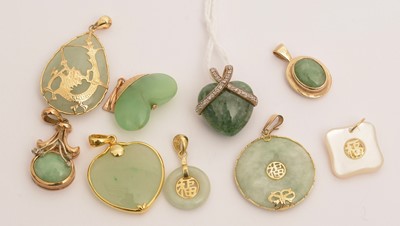 Lot 113 - Jade and other green stone pendants