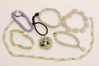 Lot 114 - Jade and other green stone jewellery