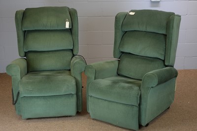 Lot 488 - Pair of green electric reclining armchairs.