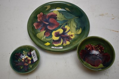 Lot 387 - Moorcroft 'Hibiscus' pattern dish and bowl; and another dish.
