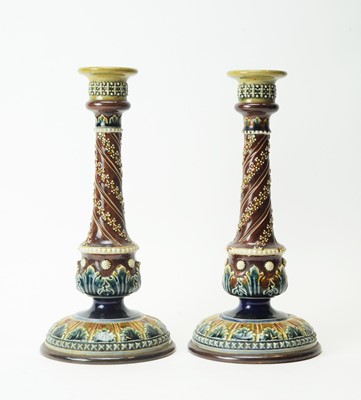 Lot 632 - Pair of Doulton Lambeth stoneware candlesticks.