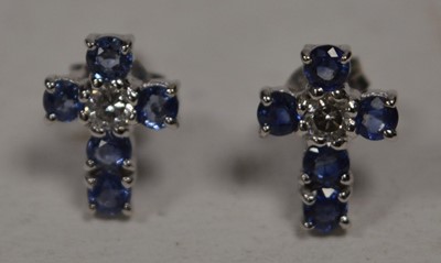 Lot 66 - A pair of sapphire and diamond cross pattern earrings