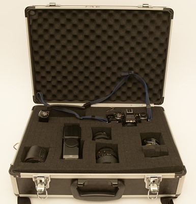 Lot 938 - Minolta camera and assorted lenses.