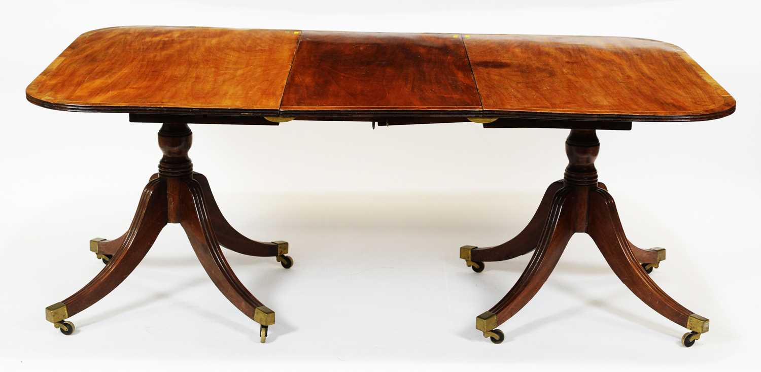 Lot 425 - A late 19th Century mahogany twin pedestal dining table.