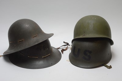 Lot 1059 - Two British WWII Zuckerman helmets, WWII American M1 helmet and US Military Police helmet