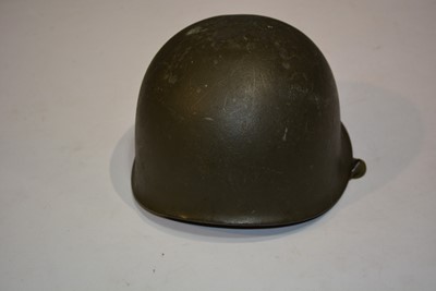Lot 1059 - Two British WWII Zuckerman helmets, WWII American M1 helmet and US Military Police helmet