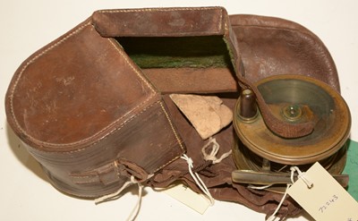 Lot 710 - A cast wallet and contents; fishing reel