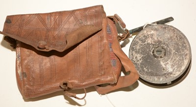 Lot 657 - 3 1/2in. fishing reel and pouch (distressed).