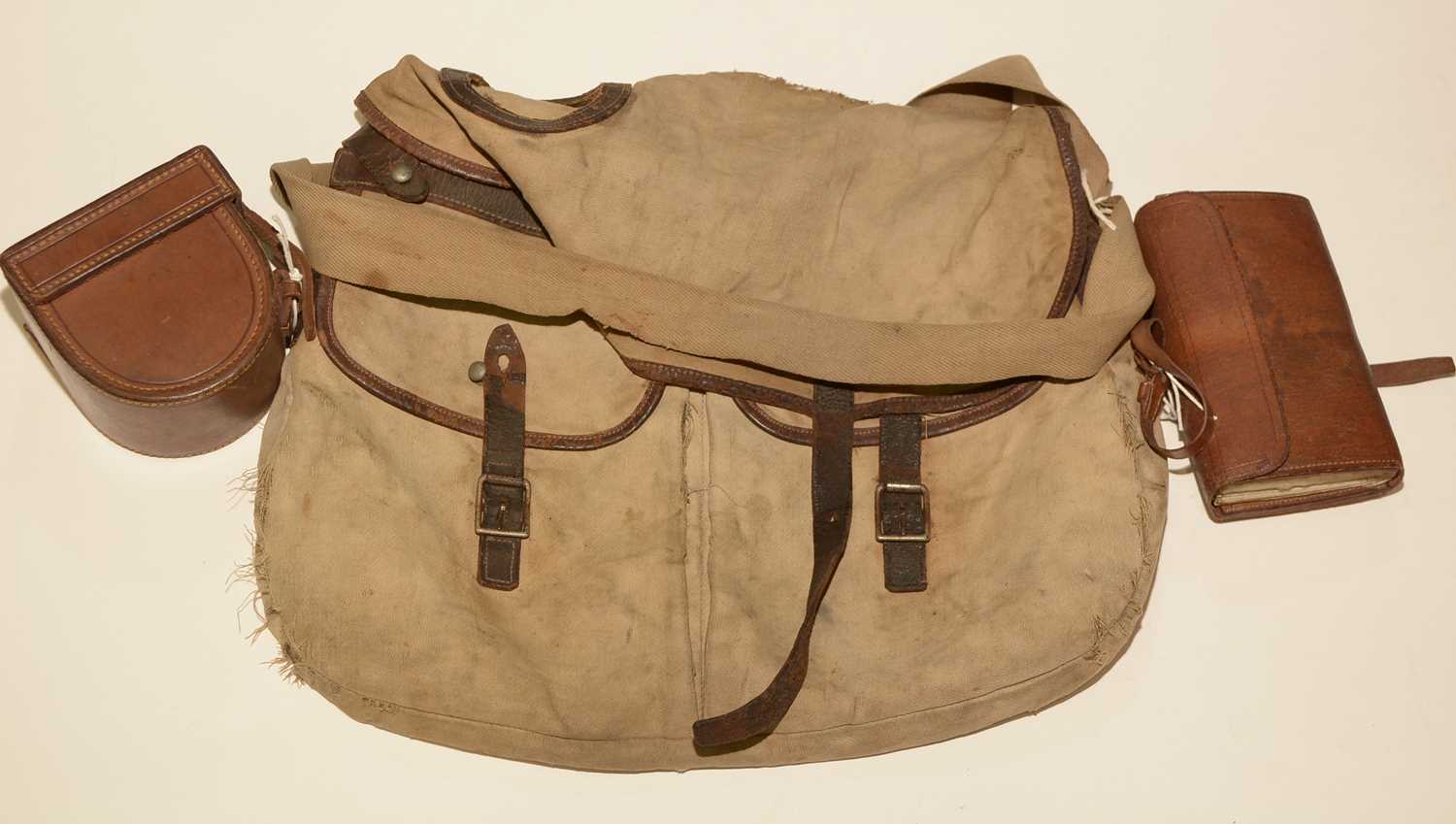 Lot 710 - A cast wallet and contents; fishing reel case; and a fishing bag.
