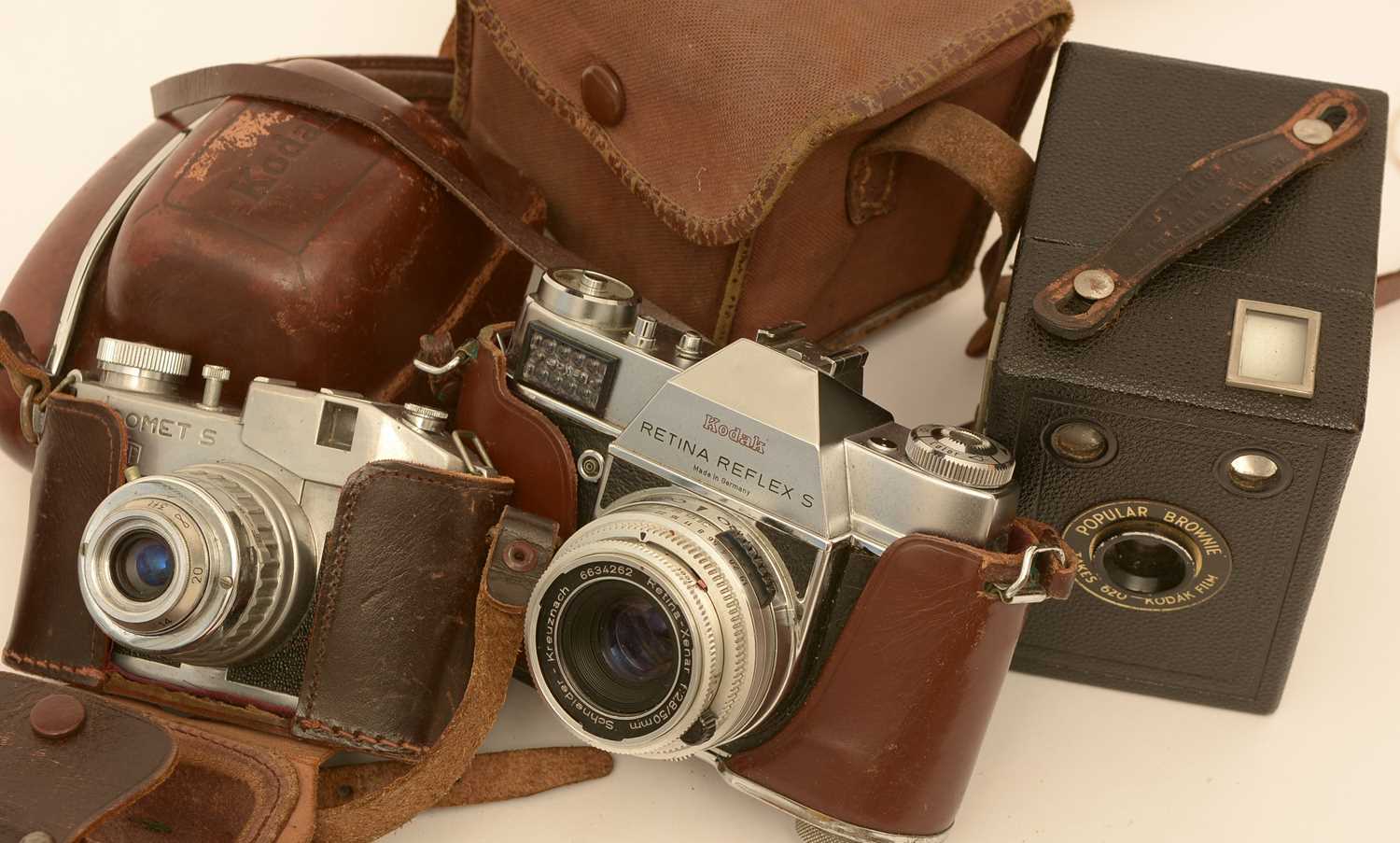 Lot 853 - Three vintage cameras.