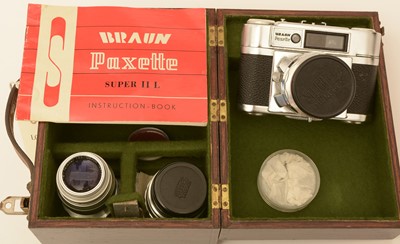 Lot 886 - A Braun Paxette camera and lenses.