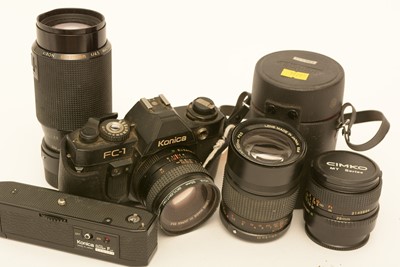Lot 873 - A Konica camera and lenses.