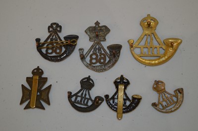 Lot 1013 - Collection of nine Durham Light infantry cap badges