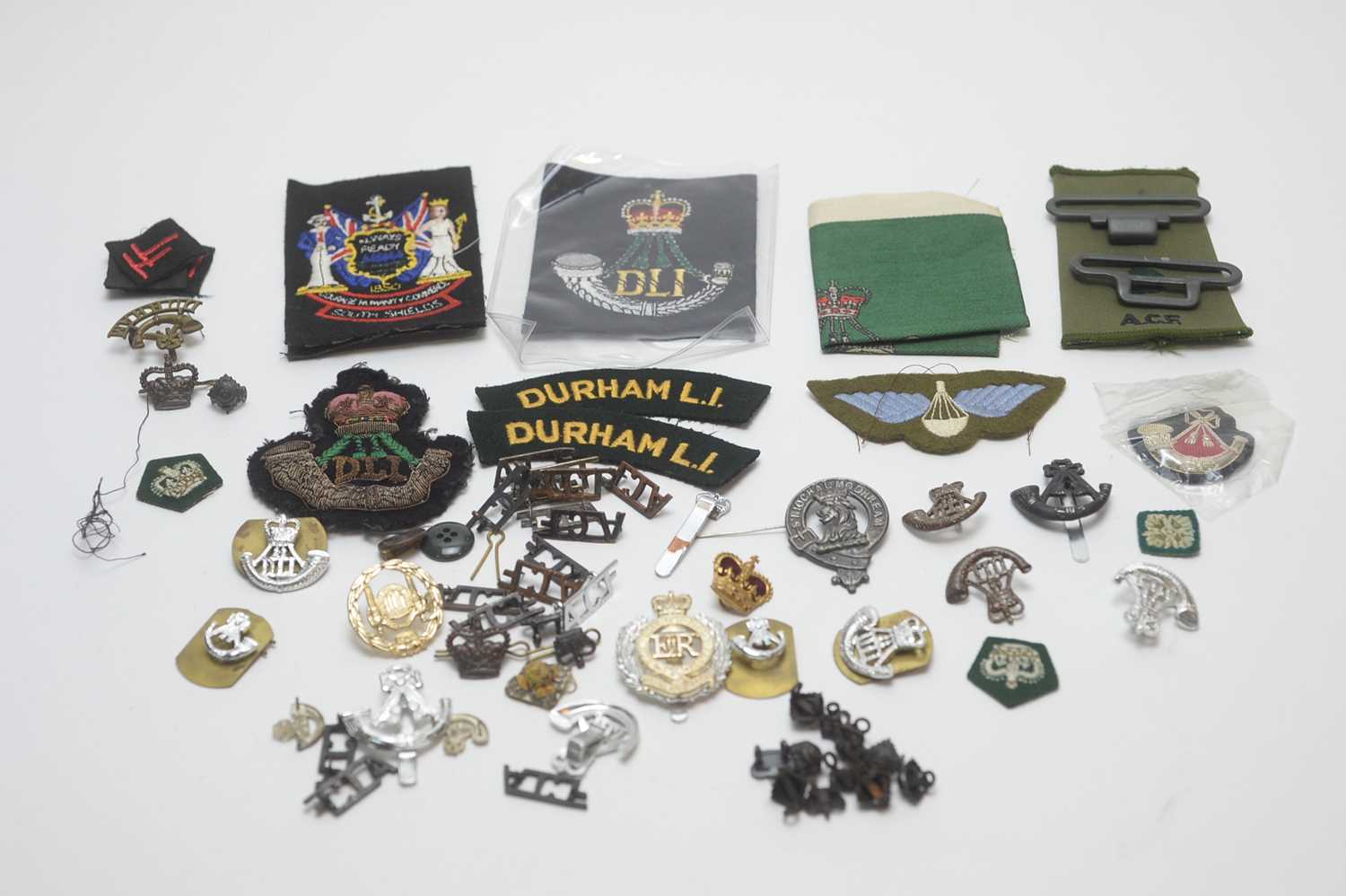 Lot 958 - Collection of military buttons, cap badges, shoulder titles.