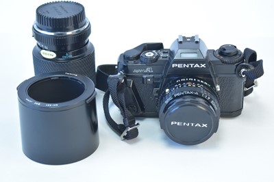 Lot 830 - A Pentax camera and lens; and a Tokina lens.