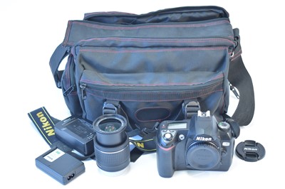 Lot 831 - A Nikon camera and lens.