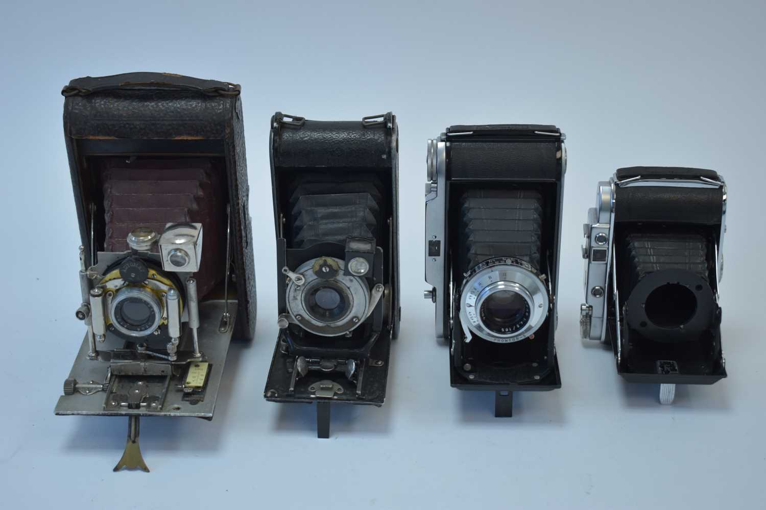Lot 803 - A Voigtländer Bessa and three other folding cameras.