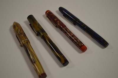 Lot 662 - Four fountain pens in marbled cases