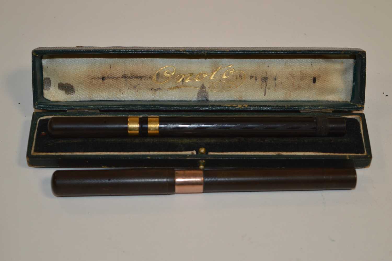 Lot 694 - Two fountain pens with gold bands