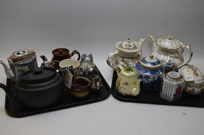 Lot 138 - Two Victorian gilt enriched teapots; black...