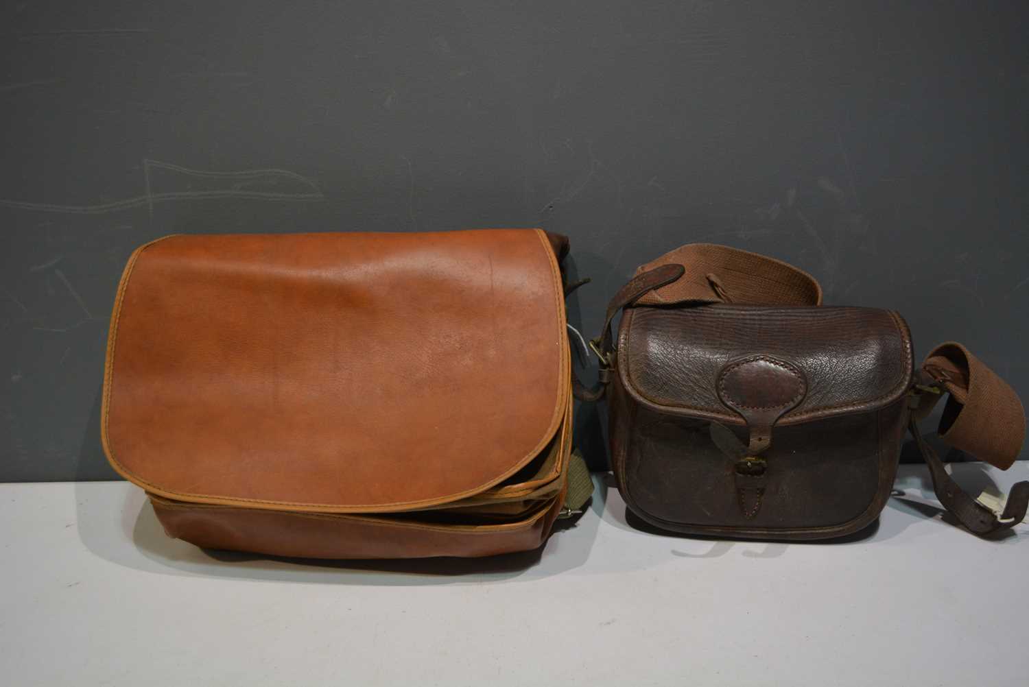 Lot 770 - A canvas and leather fishing bag; a vintage