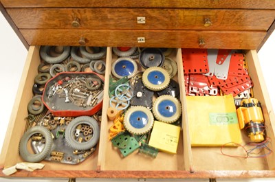 Lot 280 - Meccano in an oak chest of drawers