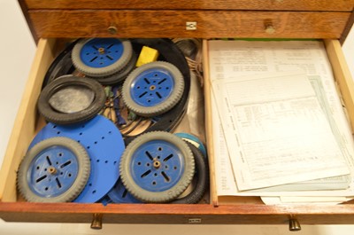 Lot 280 - Meccano in an oak chest of drawers