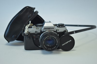 Lot 947 - An Olympus camera with Zuiko lens and case