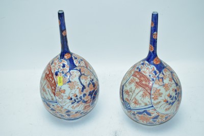Lot 337 - Pair of Japanese Imari bottle vases.